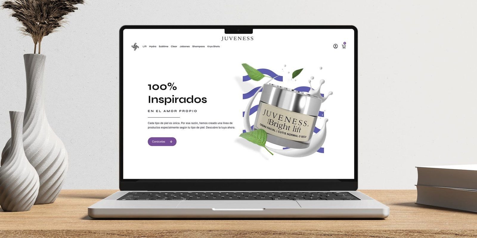 Laptop showing the store’s home page: “100% inspirados”