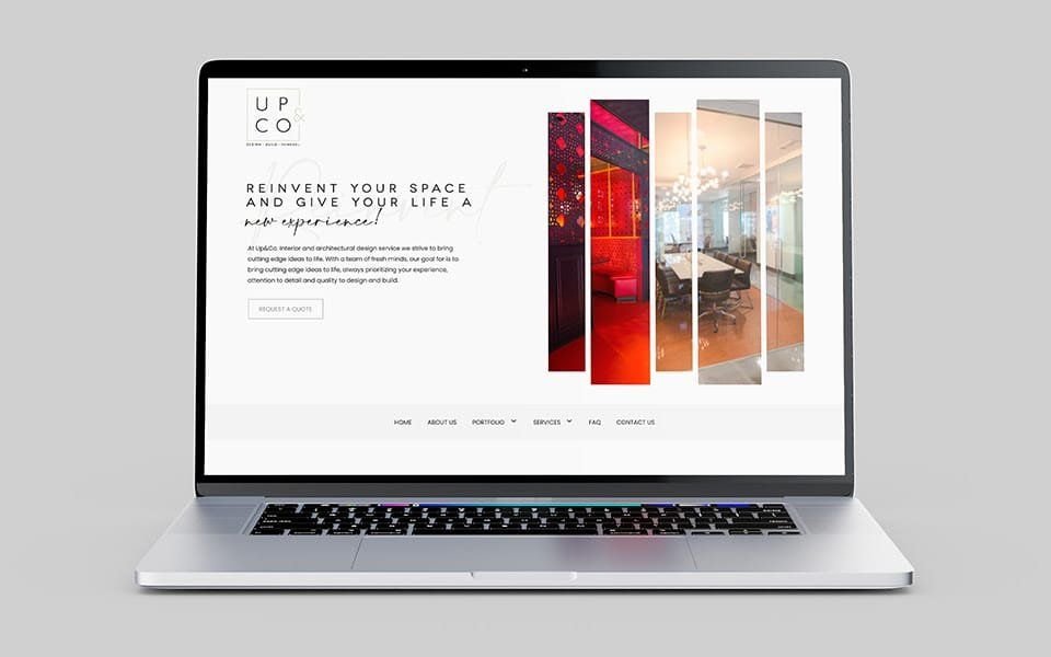 A laptop showing the Up &amp; Co home page