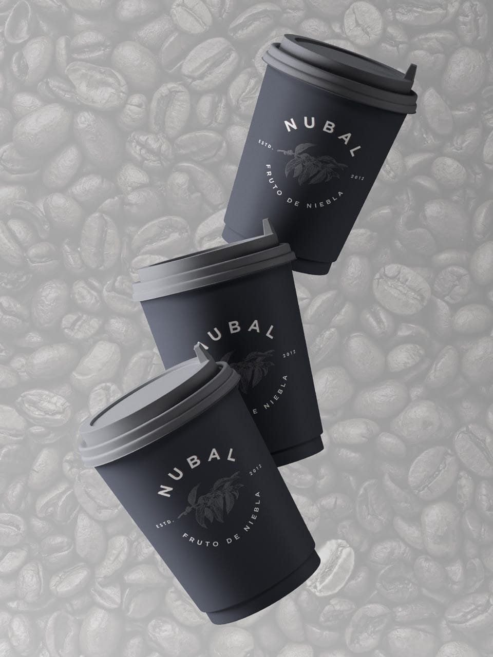 Takeaway cups with the logo, among coffee beans