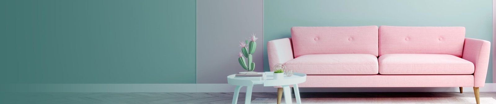 Sala con un sillón rosa y pared verde